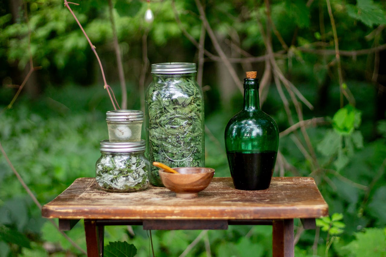 Herbs & Oils in Jars in the Forest